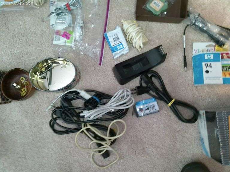 Misc cords, marbles, printer ink, speakers, paper, slim CDs. Upstairs