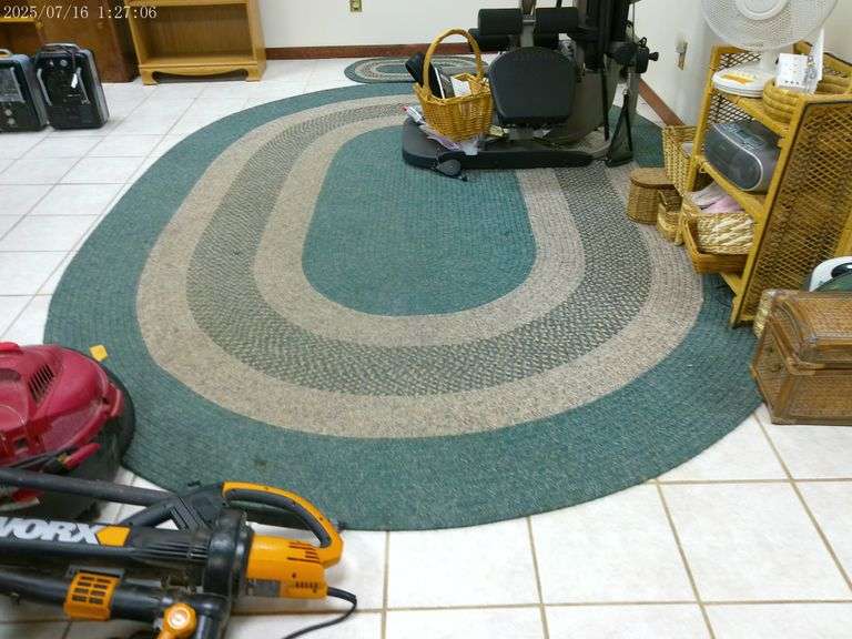 Oval braided rug 11'x8' & small matching rug 3' x 2'. In basement