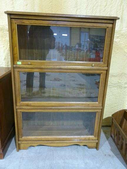 300 - 9 Oak (solid top and laminate) lawyers bookcase. 3-tiered 1 unit that sections do not separate
