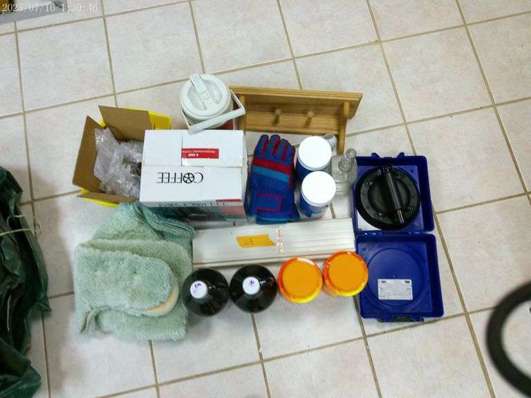 Mr Coffee, gloves, bottles, 2 unopened Metamucil, suction cup for glass, bathroom rug, 2 unopened Ma