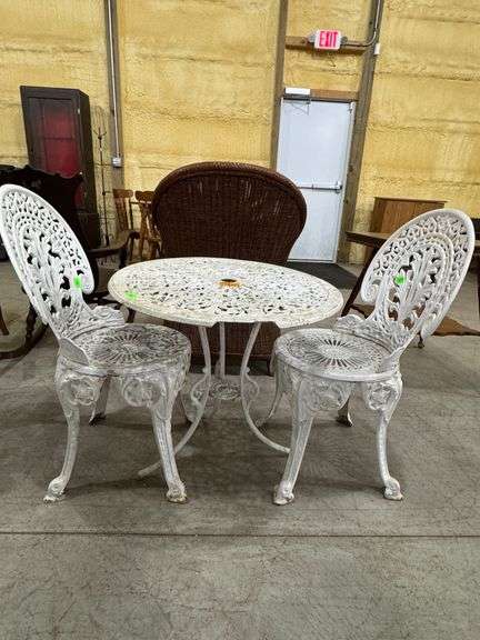 Metal patio set, table and 2 chairs. Table top has damage