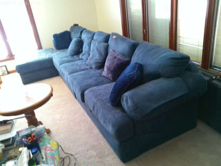 Blue sectional with pillows. 13' long. Main level
