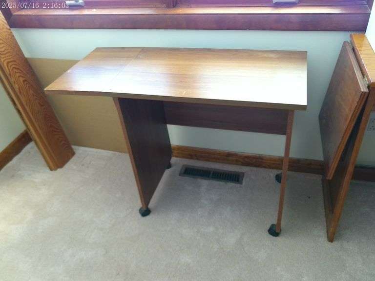 Rolling office table. 3' wide with drop leaf up. Upstairs