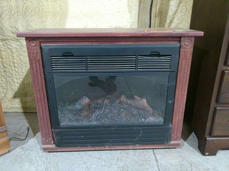 303 - 5 Electric fireplace on casters, works. 32" wide, 11" deep, 26" tall