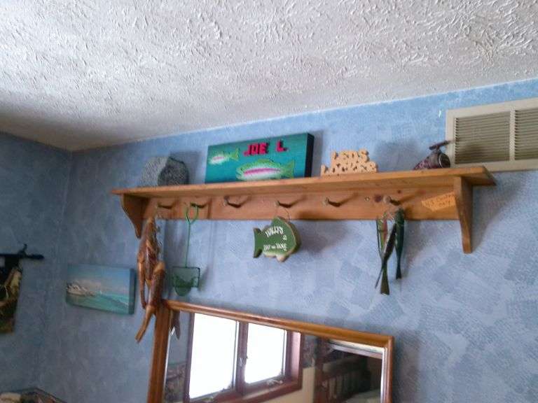 Fishing related decorative items. Does NOT include shelf. Upstairs