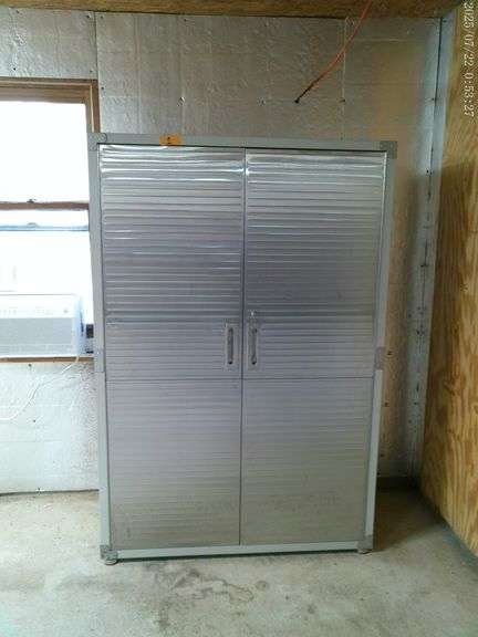 Metal double door cabinet 71 inches tall 48 inches wide