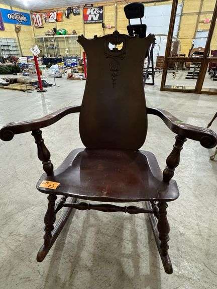 Antique mahogany rocker with vase back and carvings