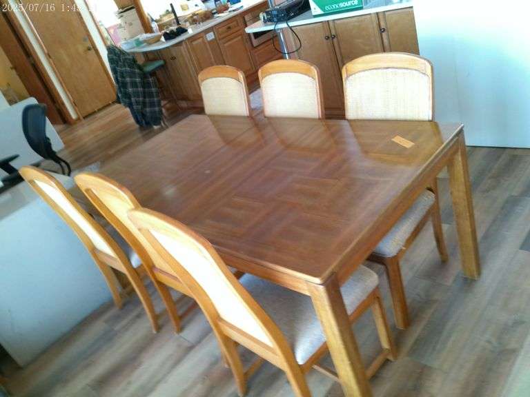 Table and 6 chairs. Table with leaf is 70". Main level