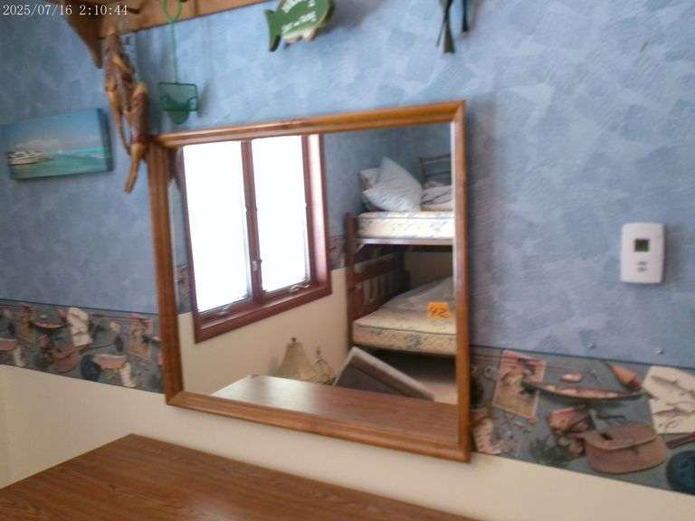 Wall mirror with wood frame, 38"x32". Upstairs