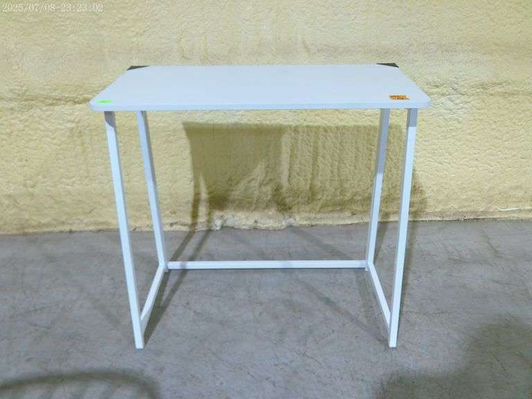 352 Small white folding table. 32"x16"x30"