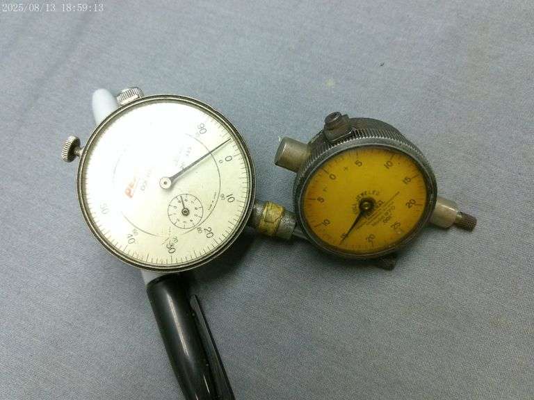 Peacock 1" travel indicator & Federal 1/8" travel indicator. Works well