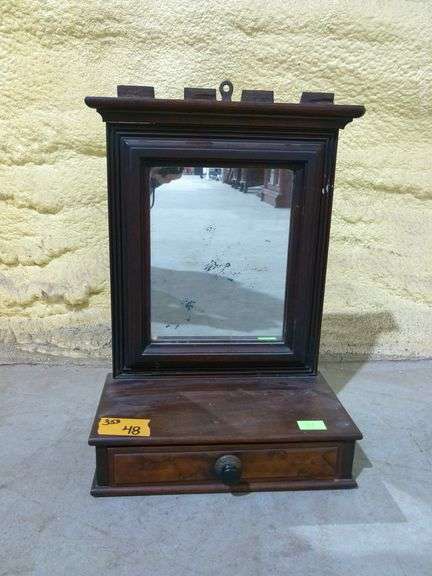 353 Small mirror with drawer at base. 12"x7"x18"