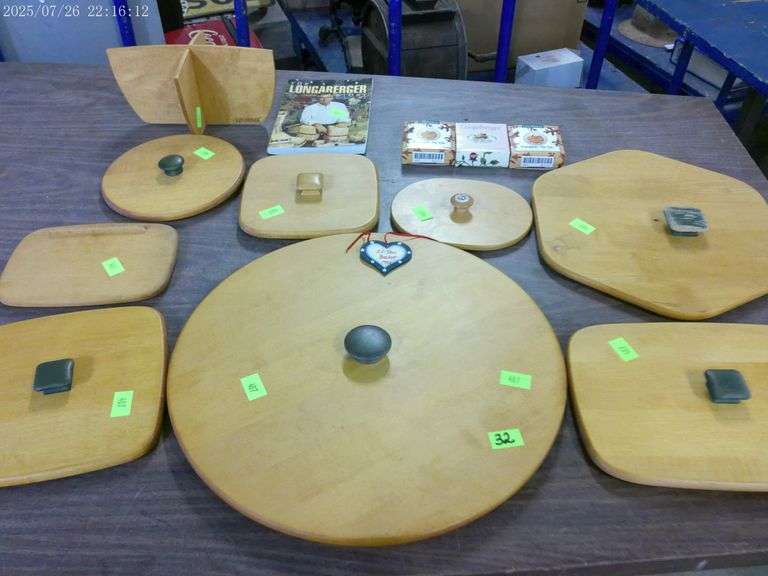 8 Longaberger lids of various sizes (handle is off large lid); The Longaberger Story book; wooden di