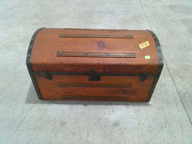 407 - dome top storage trunk, wood construction and metal banding. Has end handles and drawer inside