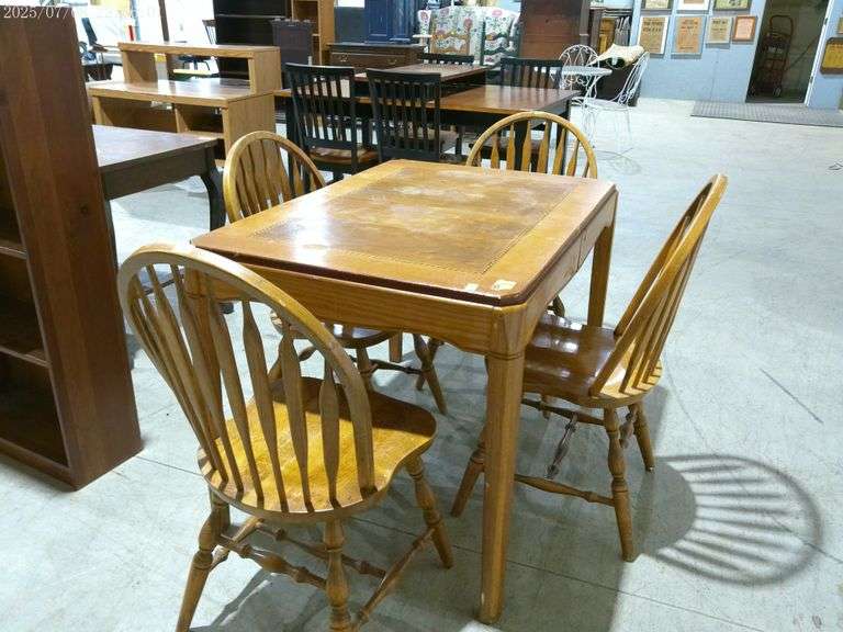 353 Table and 4 chairs Windsor style chairs. Table top is 42"x30". No leaf