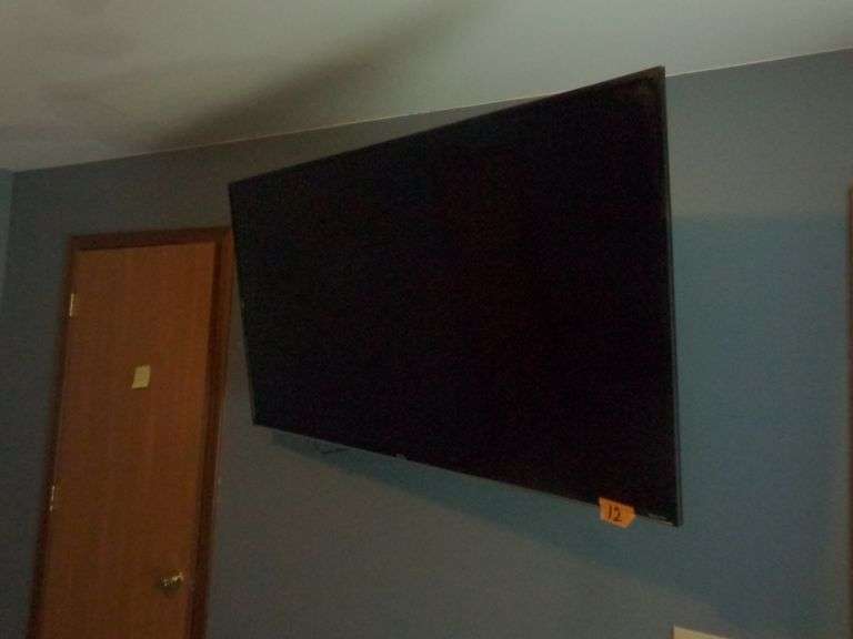 Roku 55" TV with Remote. Tv is untested. Tv is bolted to the wall on a swivel bracket. Buyer must re