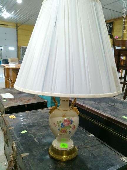 452 - Victorian style urn lamp with gold accents and floral design. White pleated shade, 25" tall