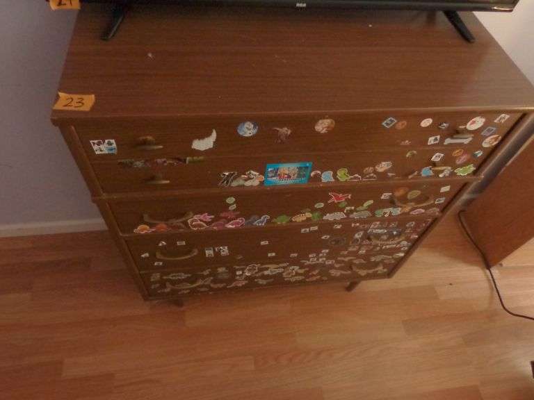 Mid-Century Modern 5 Drawer Chest of Drawers. It does have stickers all over it. See pictures for co