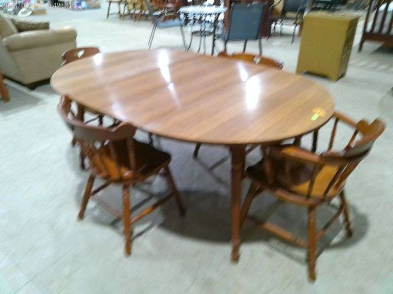502- Dining table and 4 chairs. Table with 2 leaves is 70"