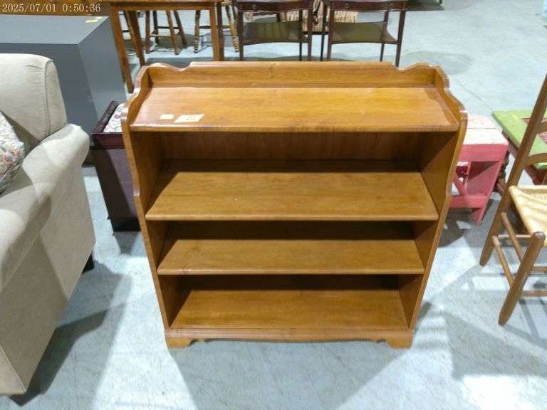 504- Wooden bookshelf with adjustable shelves. 36" wide, 36" tall
