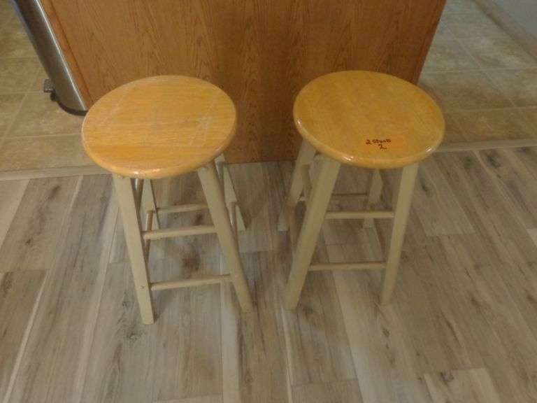 2 Wooden Barstools. 2' Tall x 1' Diameter. See pictures. Located in the kitchen.