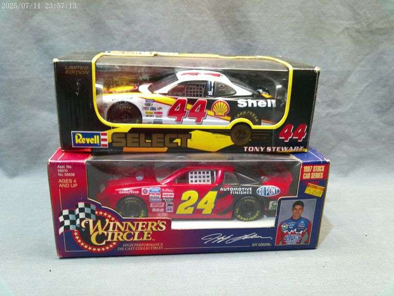 2 die cast 1:24 scale cars - Tony Stewart, Jeff Gordon. In boxes