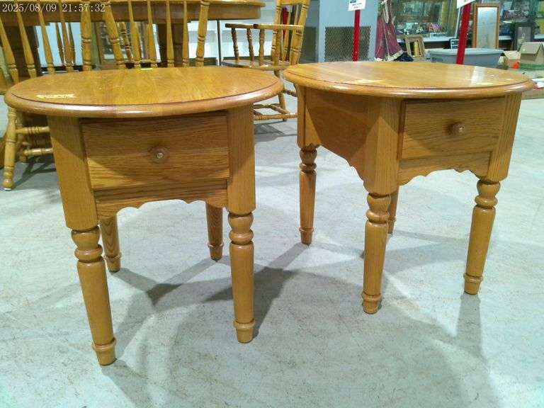 456 - Pair of oval oak end tables with drawer, small water stain on top of one. 26" deep. Very nice 