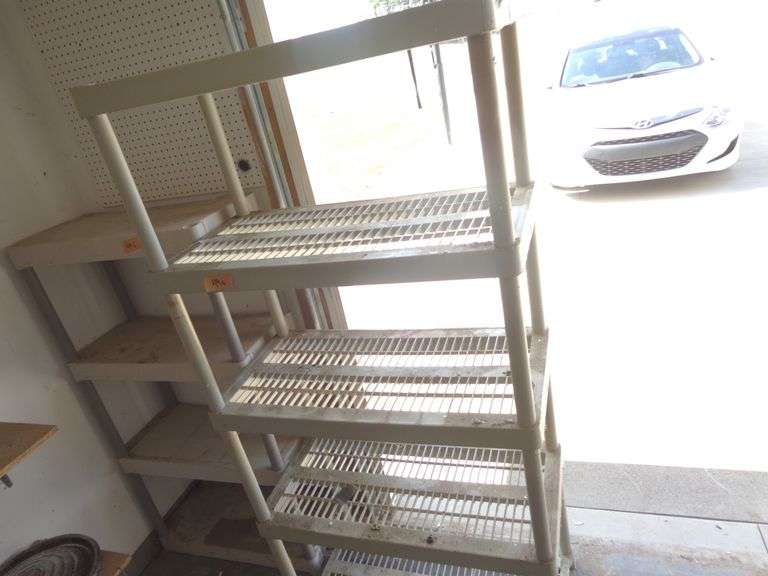 2 Rubbermaid Type Shelves. Need cleaned. See pictures. Locate in attached garage.