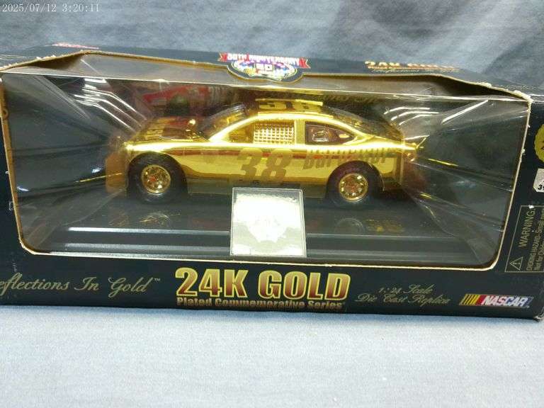 Gold plated 1:24 scale collectible car. In box