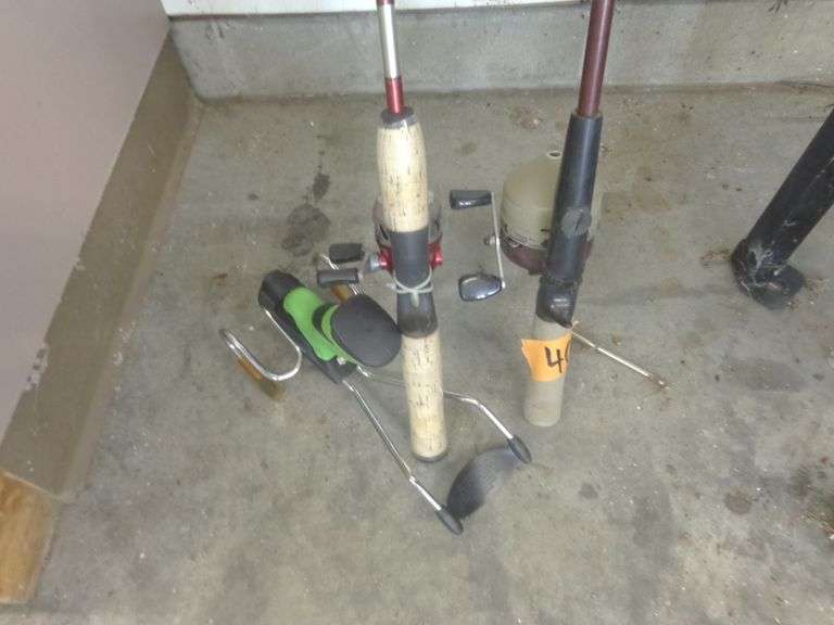 2 Fishing Poles and Pole Holder. See pictures for details. Located in attached garage.