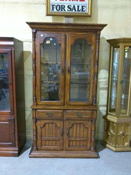 504- Keller Wood China Cabinet. Widest part is approximately 42.5". 77" tall x 18" deep. See picture