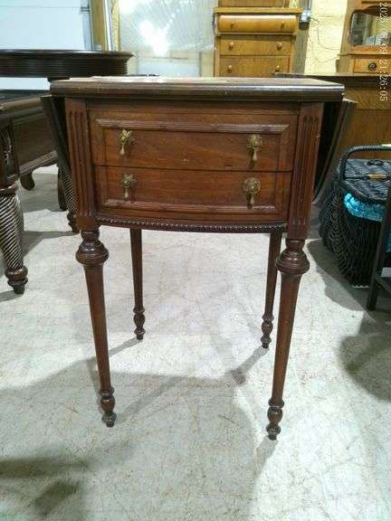 452 - Antique sewing drop-leaf sewing cabinet with 2 drawers. Significant water damage on top. 27" t