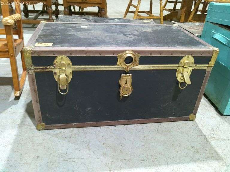 456 - Black chest. Handles are intact on the ends