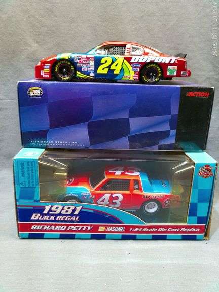 2 die cast 1:24 scale cars - Richard Petty, Jeff Gordon. In boxes