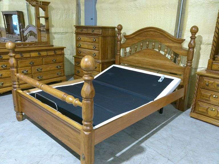 452 - 4 poster queen bed with adjustable base. Headboard has been glued (see photos). Very clean, ni