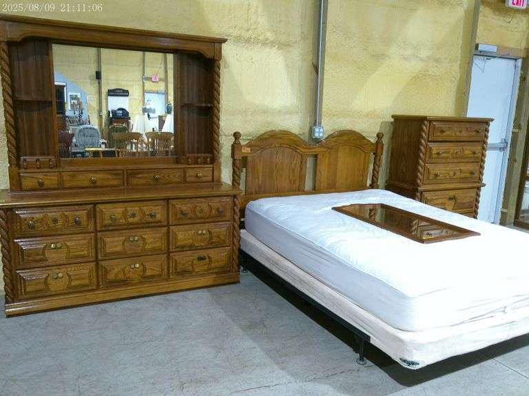 452 - 3 piece oak bedroom suite. Dresser is 64" wide with 9 drawers and mirror. Queen bed is with bo