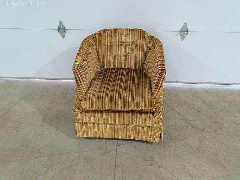 502- Vintage accent chair with striped fabric and tufted back.