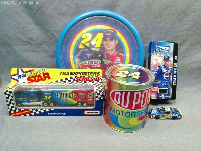 Jeff Gordon items - oil can, plastic clock, Pepsi machine tin with 1:64 car, Matchbox hauler