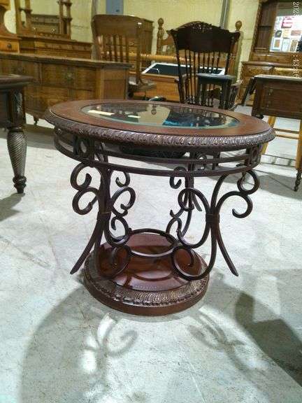 454 - Round glass/wood/metal end table. Top is 26"x24"tall. Nice condition