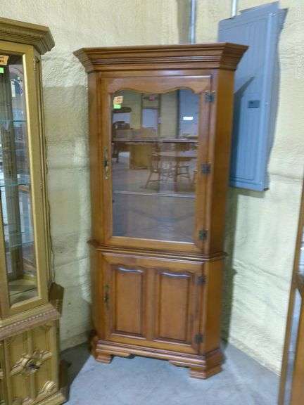 502- Tell City Corner Cabinet. 35" wide x 23" at deepest part x 71" tall. See pictures for condition