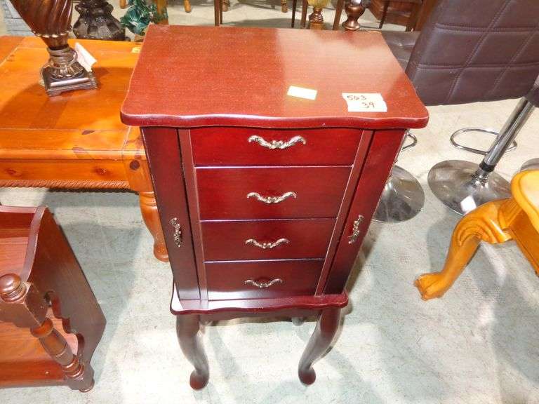 563 - Wooden jewelry cabinet. Top flips up, 3 drawers, and side necklace storage