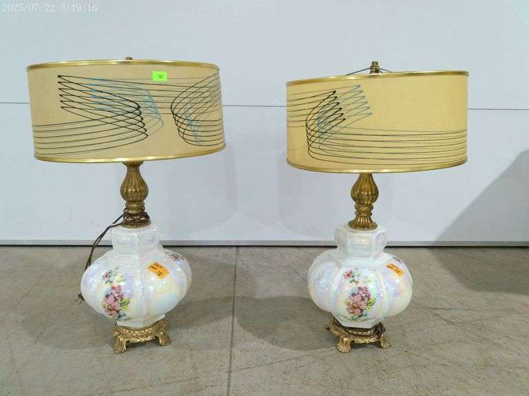 562 - Pair of large Mid Century Modern lamps with white glass base and floral designs. Drum shaped s