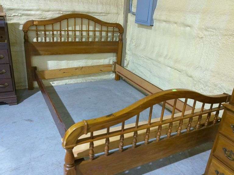 563 - Queen size wooden bed frame with wooden slats. Footboard has some marker damage