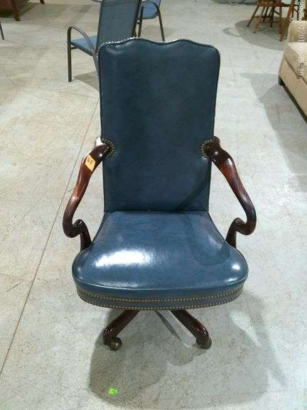 504- Office chair on rollers, blue leather-like, nail head accents
