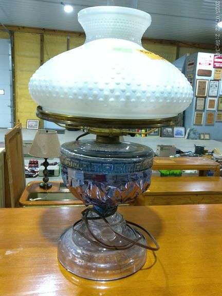 562 - Vintage hobnail milk glass hurricane lamp. Brass colored trim holds the shade; the base is pro