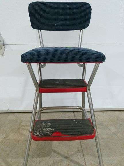 560 - Cosco step stool, has been upholstered, some damage on the rubber on the steps, some rust on f