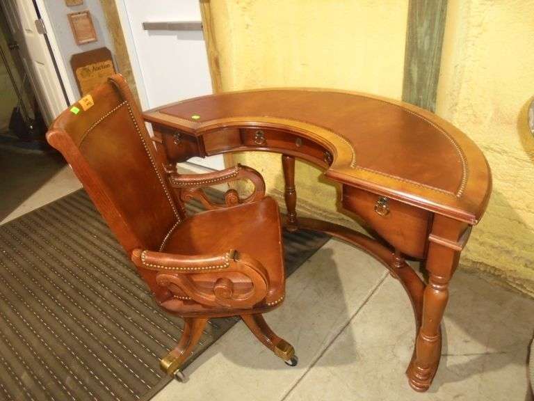 504- Wooden office with leather seat and nail-head accents, brass accents on legs with rollers