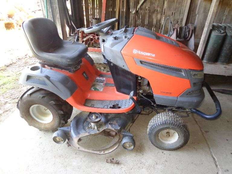 Husqvarna YTH23v48 Riding Mower. Missing guard. Hydrostatic, Shows 713 hours. Runs. Located in old b