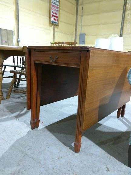 604- Wooden drop leaf table 40" deep 64" with leaves up 30" tall