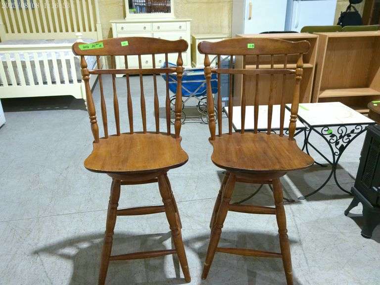 606- Pair of wooden swivel bar stools 25" tall